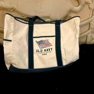 Women oversized bags/tote bags.  Old Navy cream& navy blue, small flag, 4 pocket